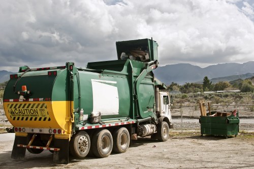 Segregated piles of green waste, timber and recyclable materials